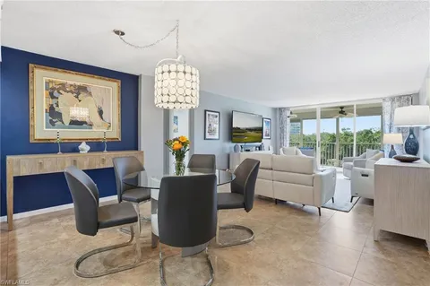 a living room with furniture and a lamp