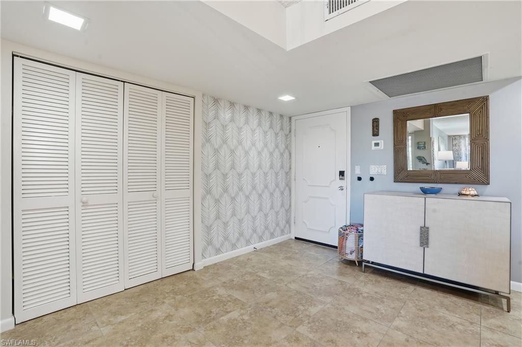 5 Bluebill Avenue, Unit 301 Naples, FL 34108 - Photo 9 of 48 a view of an empty room with a window