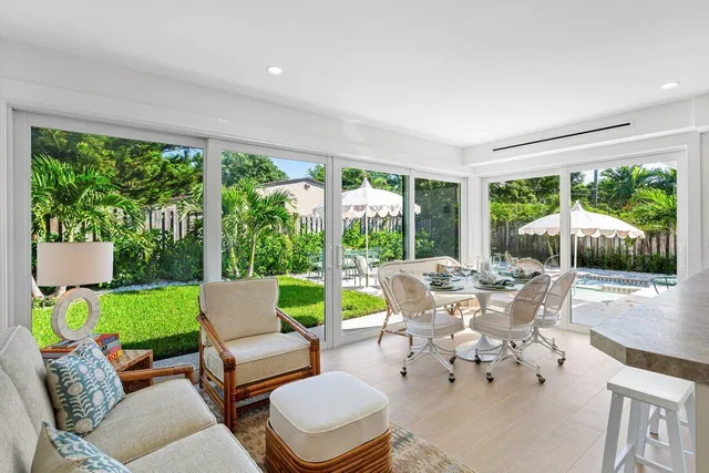 a building outdoor space with patio furniture and garden