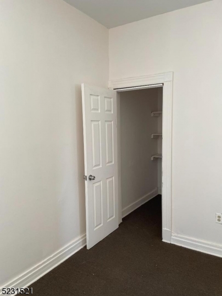 142 Hudson Street, Unit 2 Newark, NJ 07103 - Photo 11 of 13 an empty room with closet area