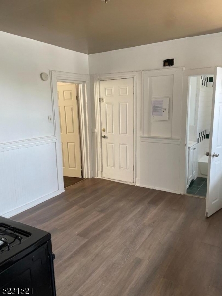 142 Hudson Street, Unit 2 Newark, NJ 07103 - Photo 5 of 13 a view of a livingroom with wooden floor