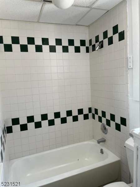 142 Hudson Street, Unit 2 Newark, NJ 07103 - Photo 8 of 13 a bathroom with a bathtub and shower