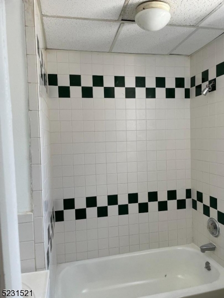 142 Hudson Street, Unit 2 Newark, NJ 07103 - Photo 9 of 13 a bathroom with a bathtub and a shower