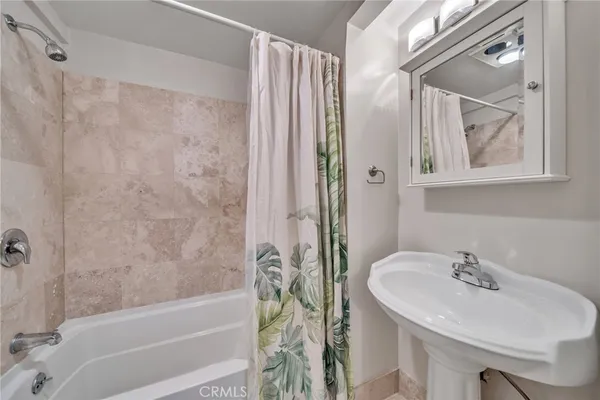 a bathroom with a sink and a bathtub