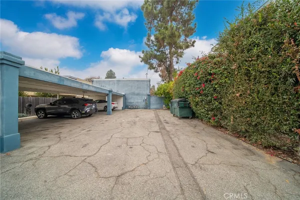 a view of a car parked in front of a building