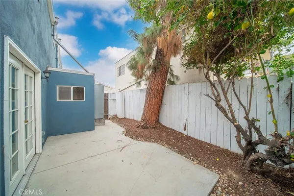 a view of a backyard of the house