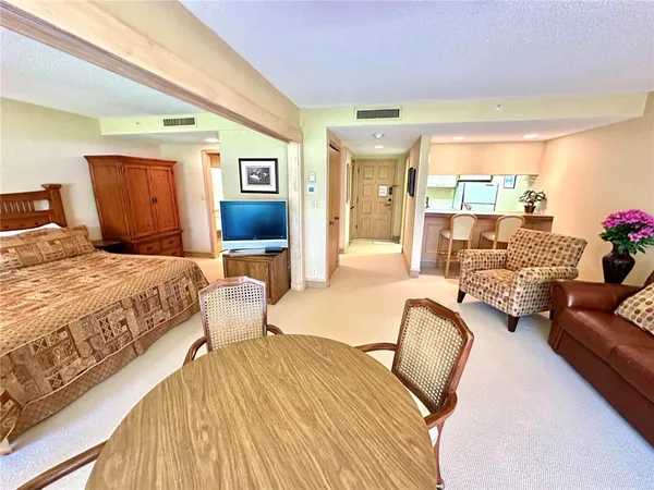 a bedroom with bed and balcony