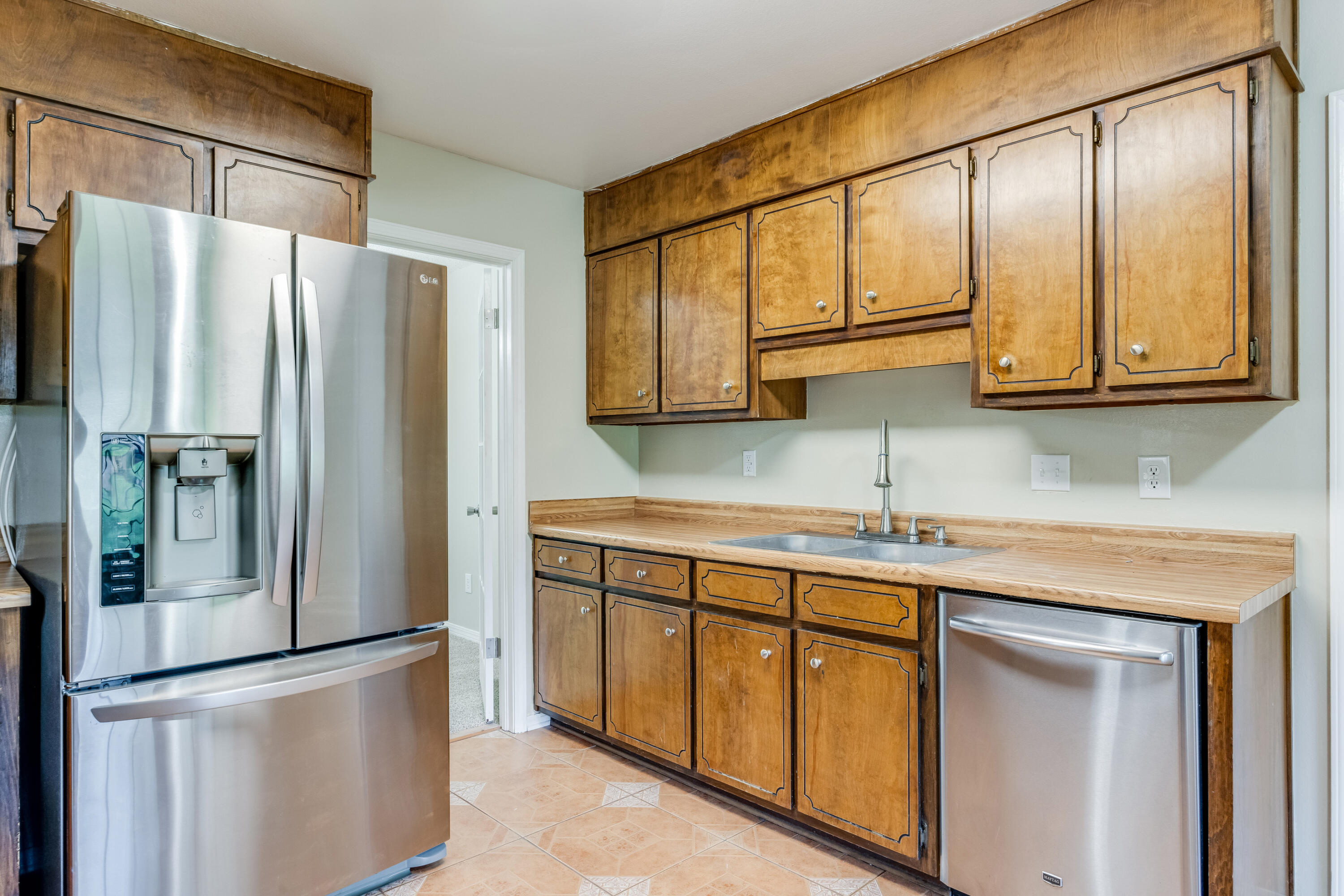 5892 Jack Stokes Road Baker, FL 32531 - Photo 17 of 49 a kitchen with stainless steel appliances granite countertop a refrigerator and a stove