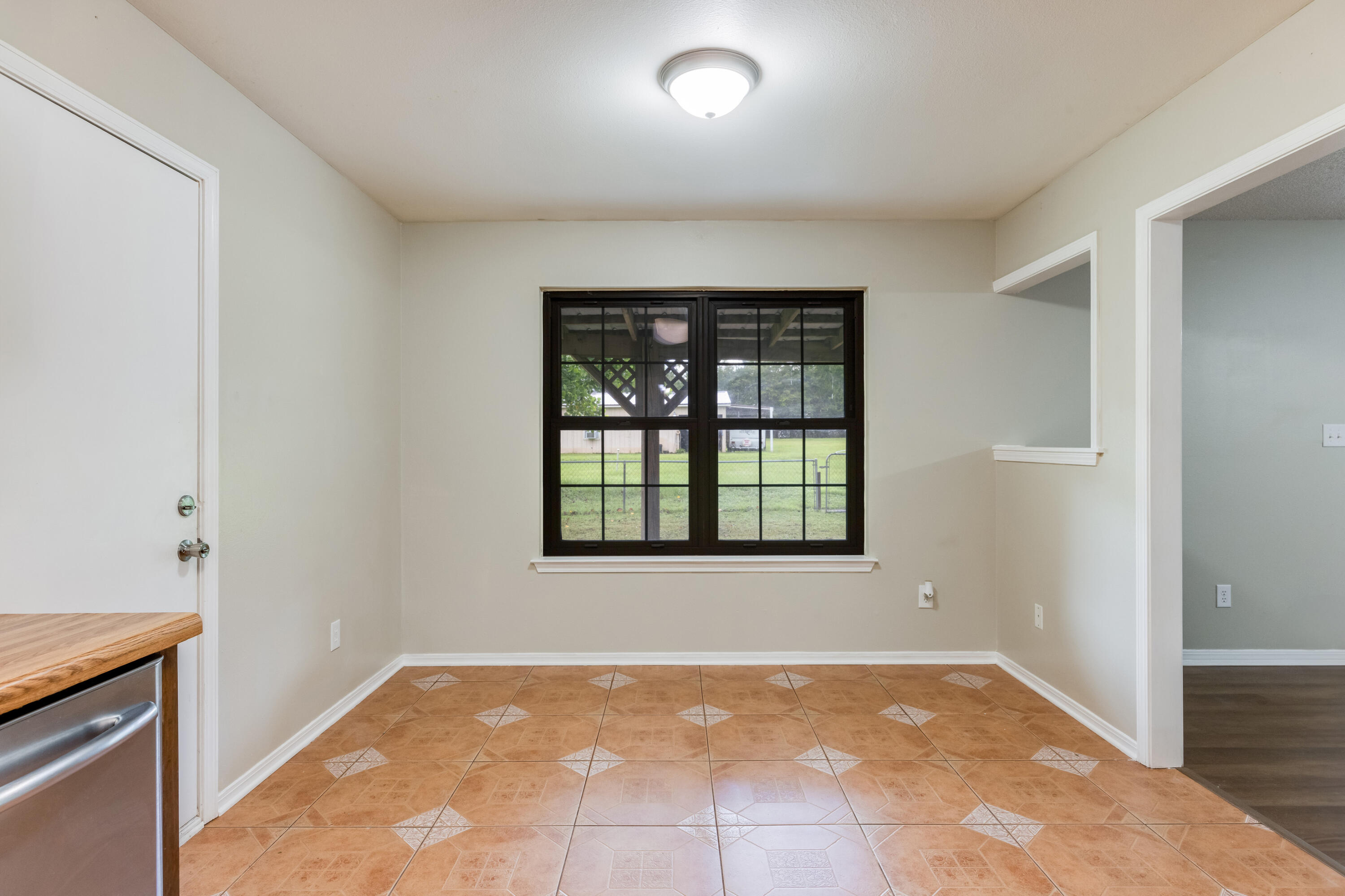 5892 Jack Stokes Road Baker, FL 32531 - Photo 18 of 49 a view of an empty room with a window