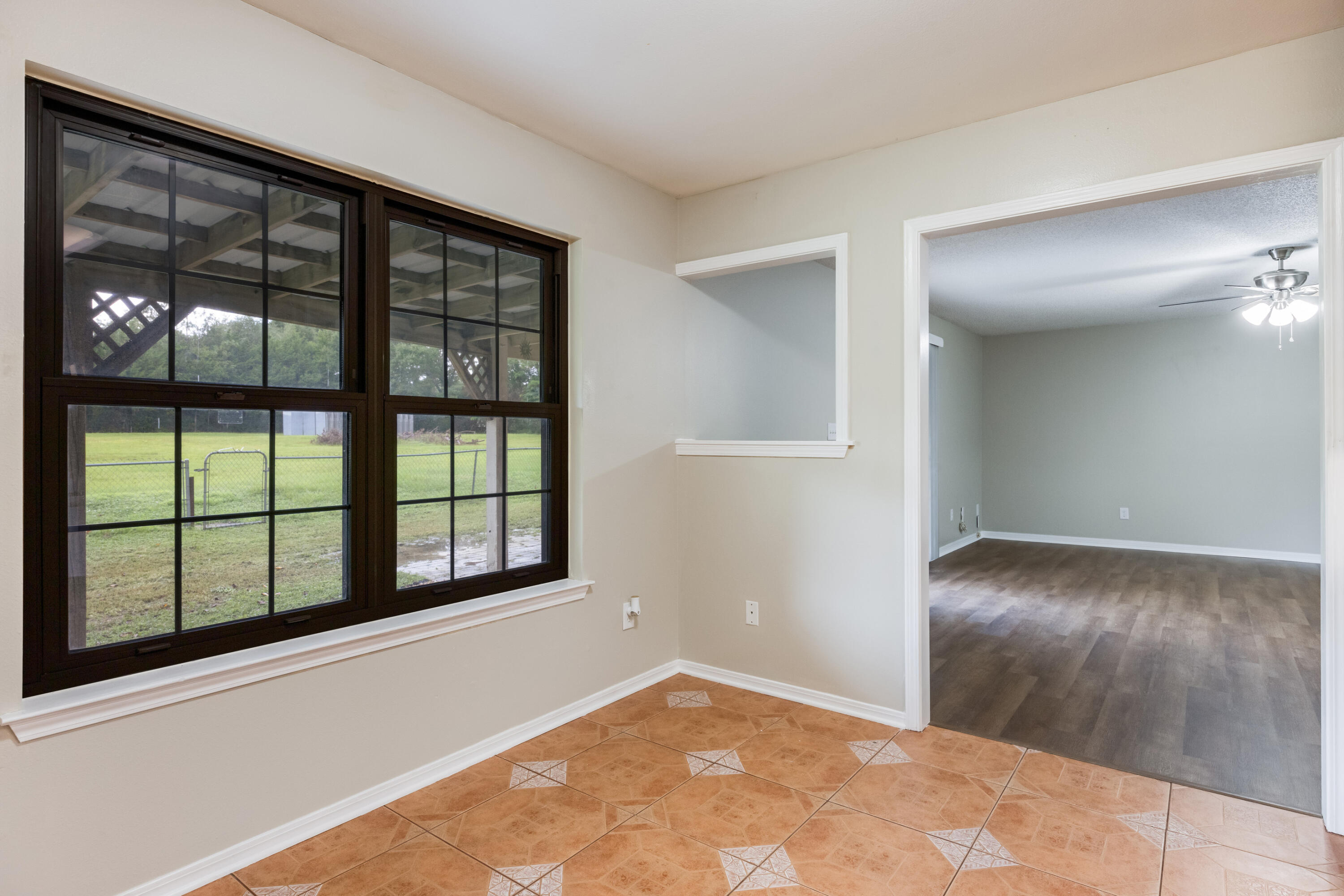 5892 Jack Stokes Road Baker, FL 32531 - Photo 19 of 49 an empty room with windows