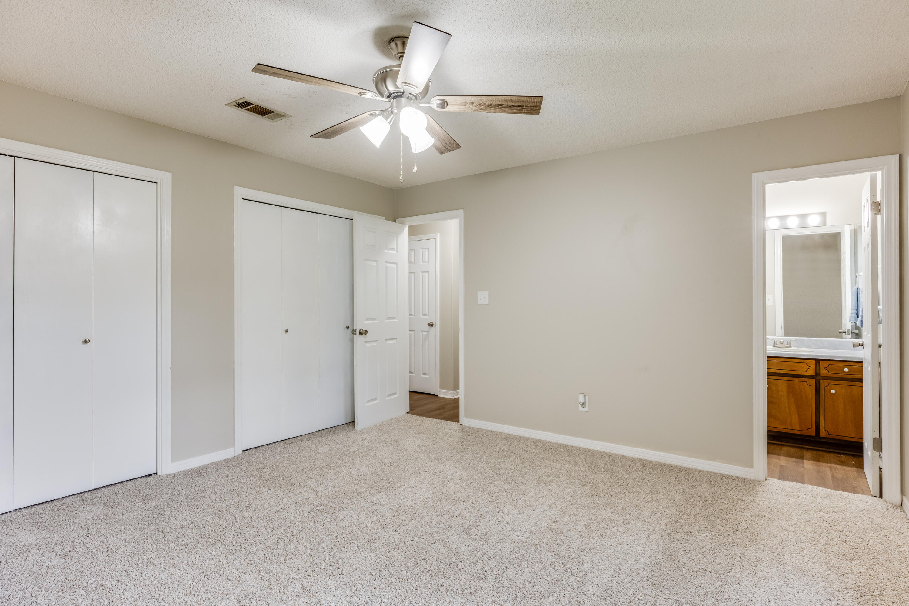 5892 Jack Stokes Road Baker, FL 32531 - Photo 22 of 49 an empty room with chandelier fan
