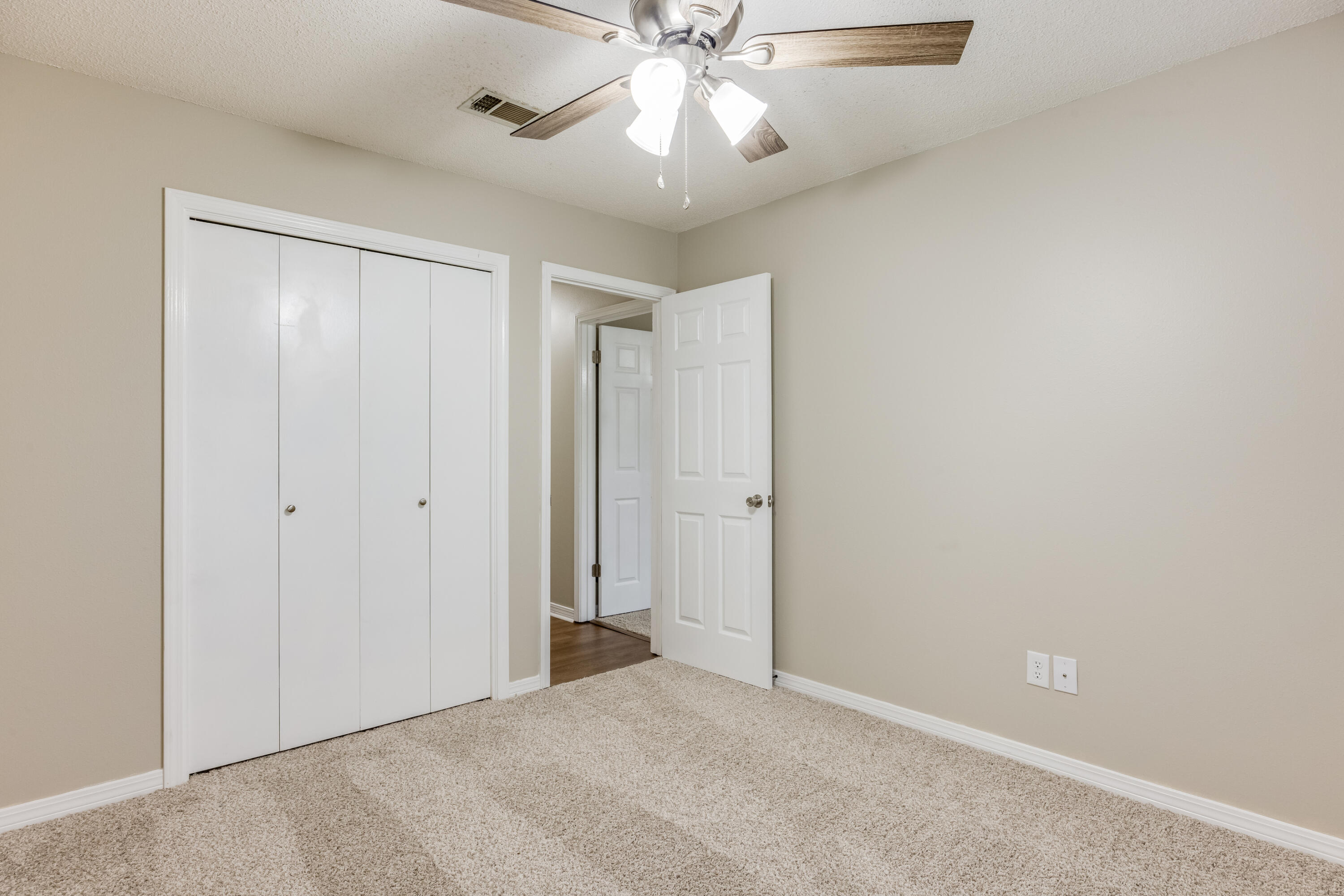 5892 Jack Stokes Road Baker, FL 32531 - Photo 25 of 49 a view of an empty room and chandelier fan