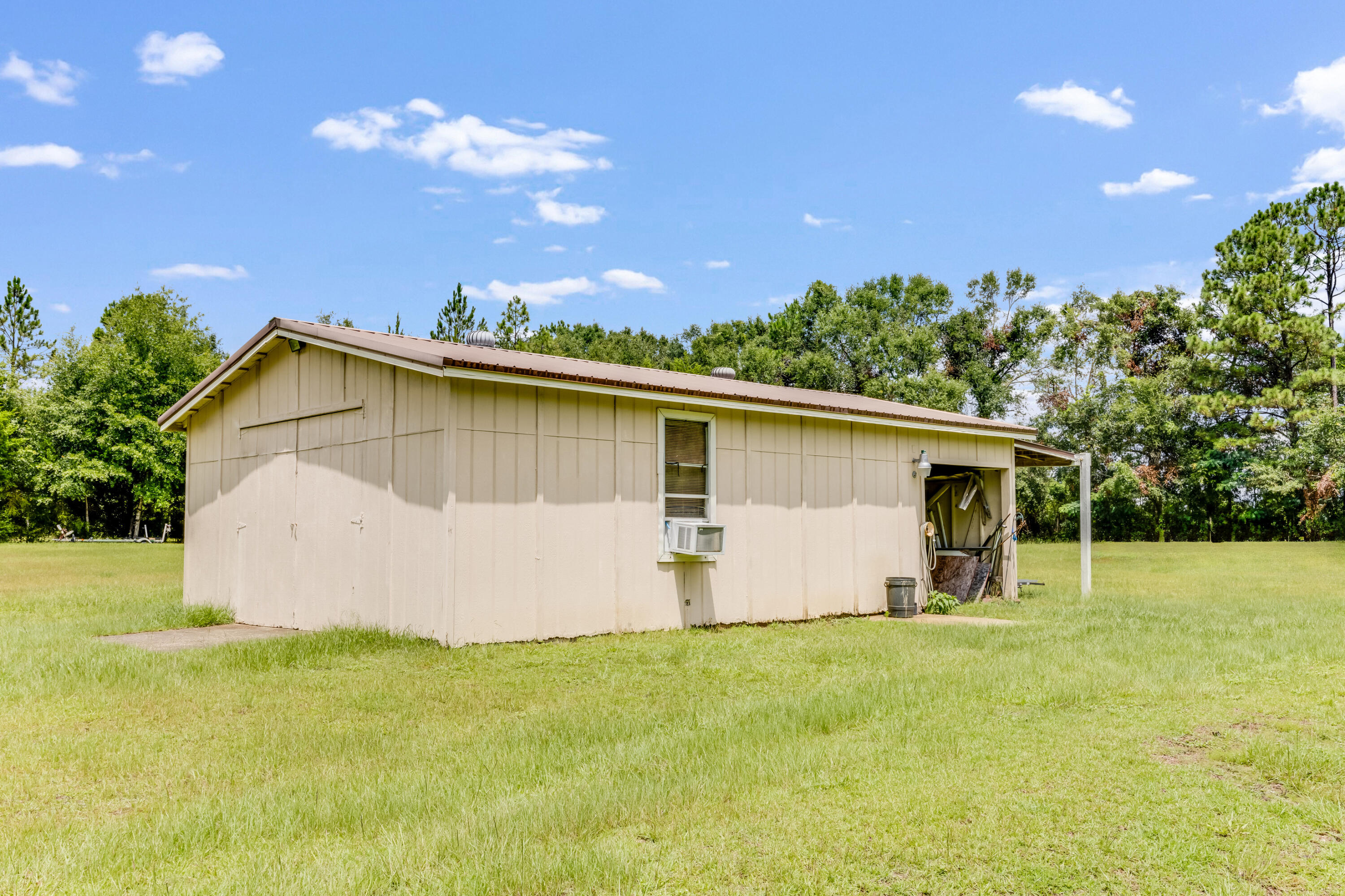 5892 Jack Stokes Road Baker, FL 32531 - Photo 30 of 49 a view of a backyard