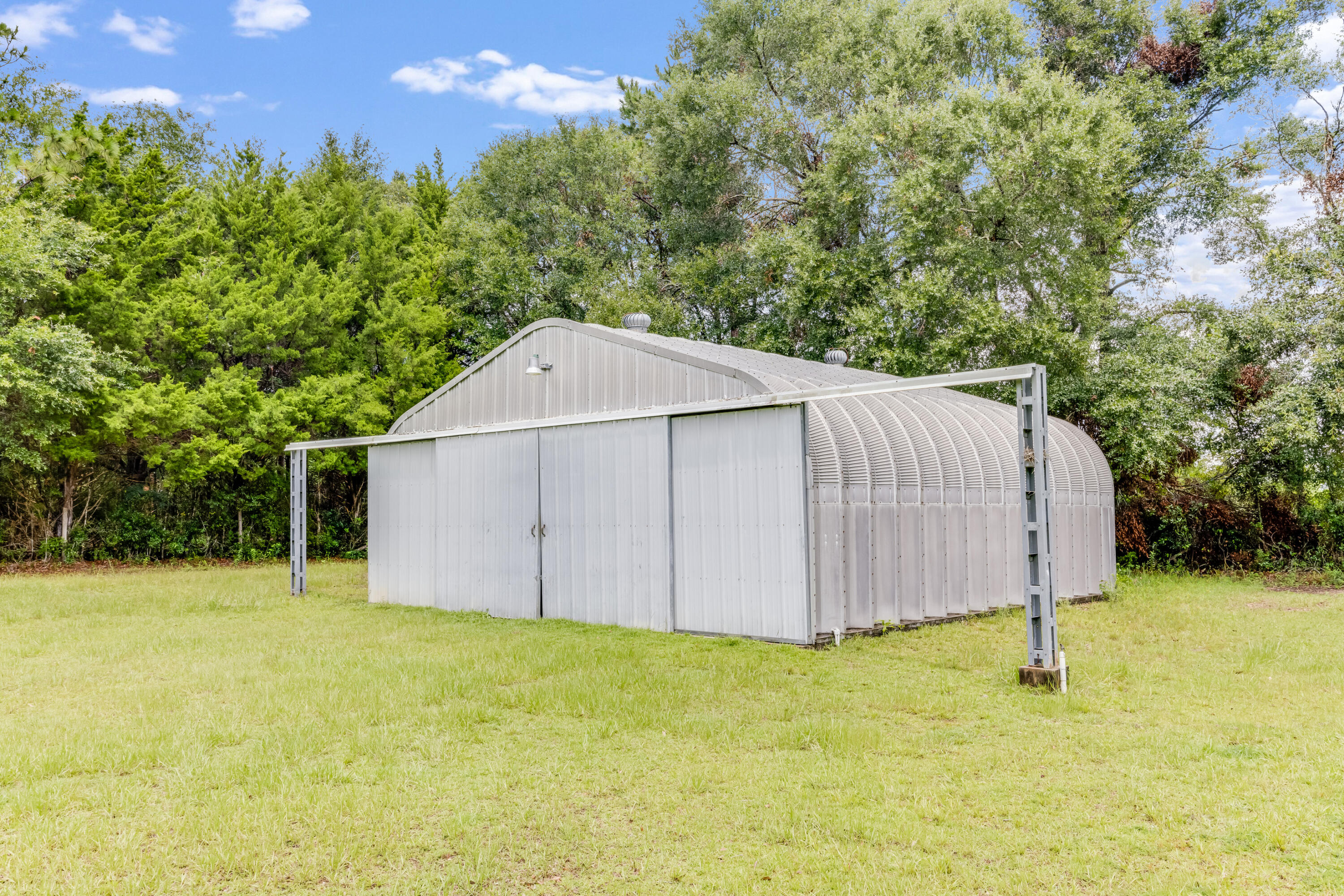 5892 Jack Stokes Road Baker, FL 32531 - Photo 33 of 49 a house with a yard
