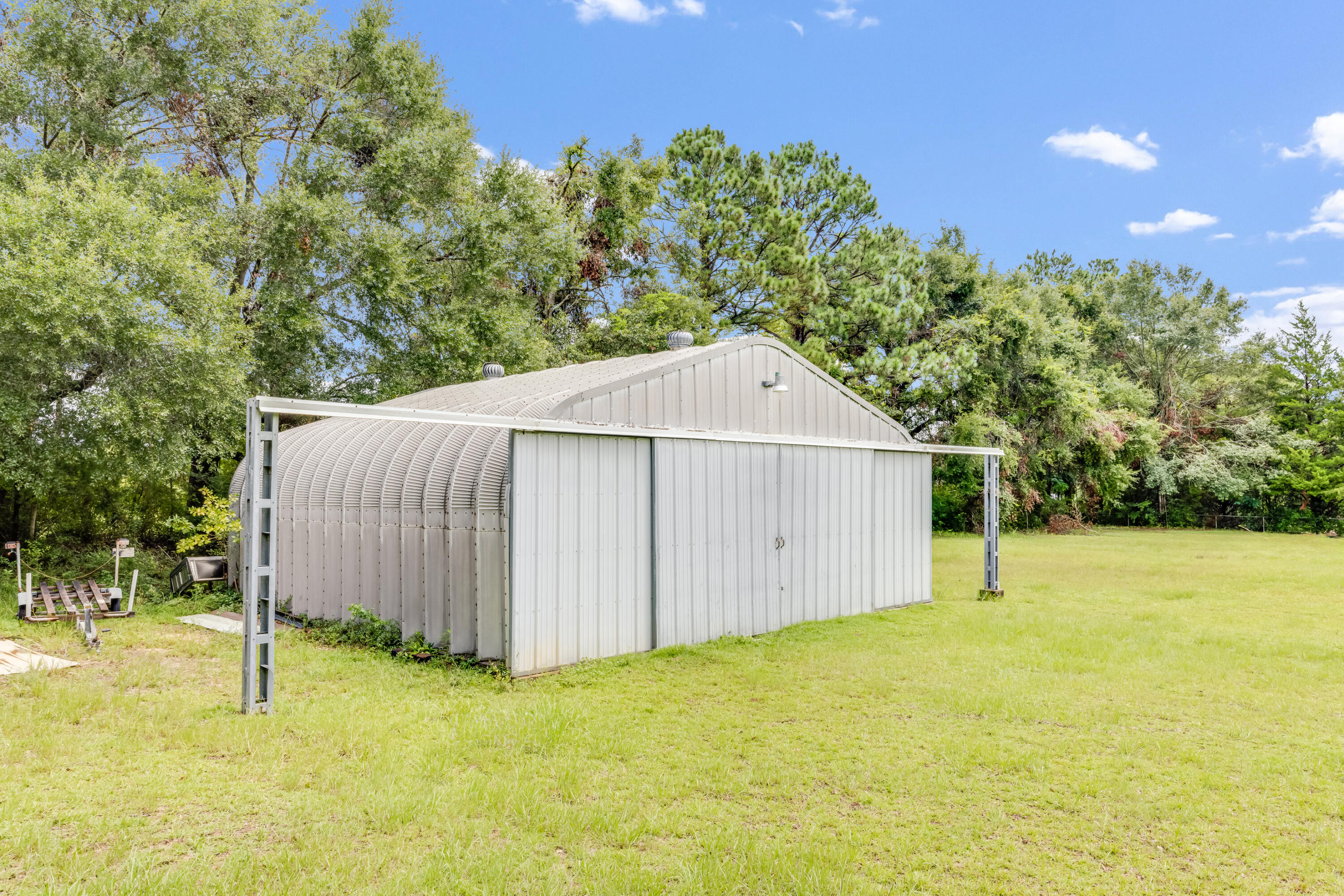 5892 Jack Stokes Road Baker, FL 32531 - Photo 34 of 49 a view of backyard with large tree and wooden fence