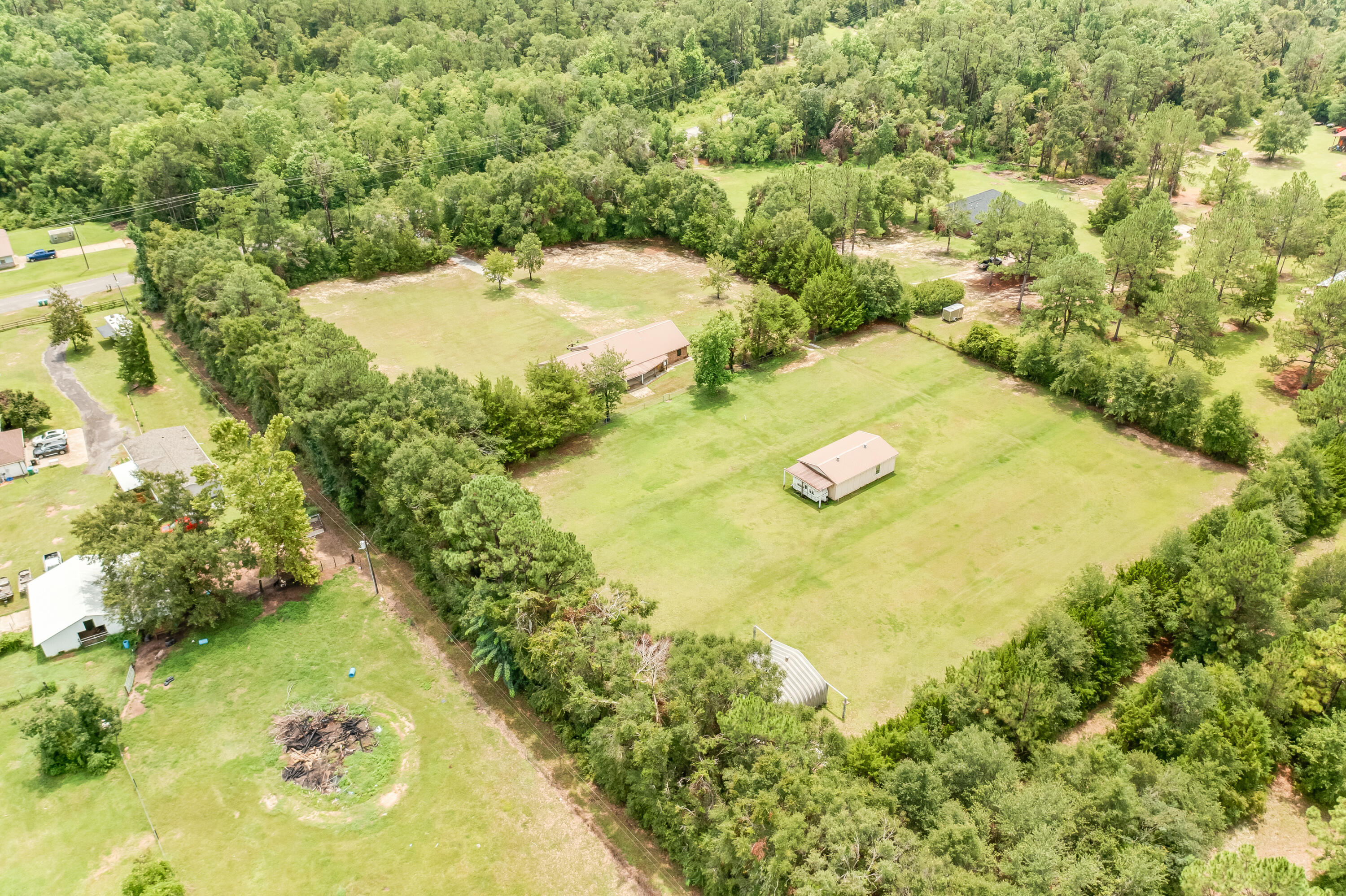 5892 Jack Stokes Road Baker, FL 32531 - Photo 46 of 49 a view of a swimming pool with a yard