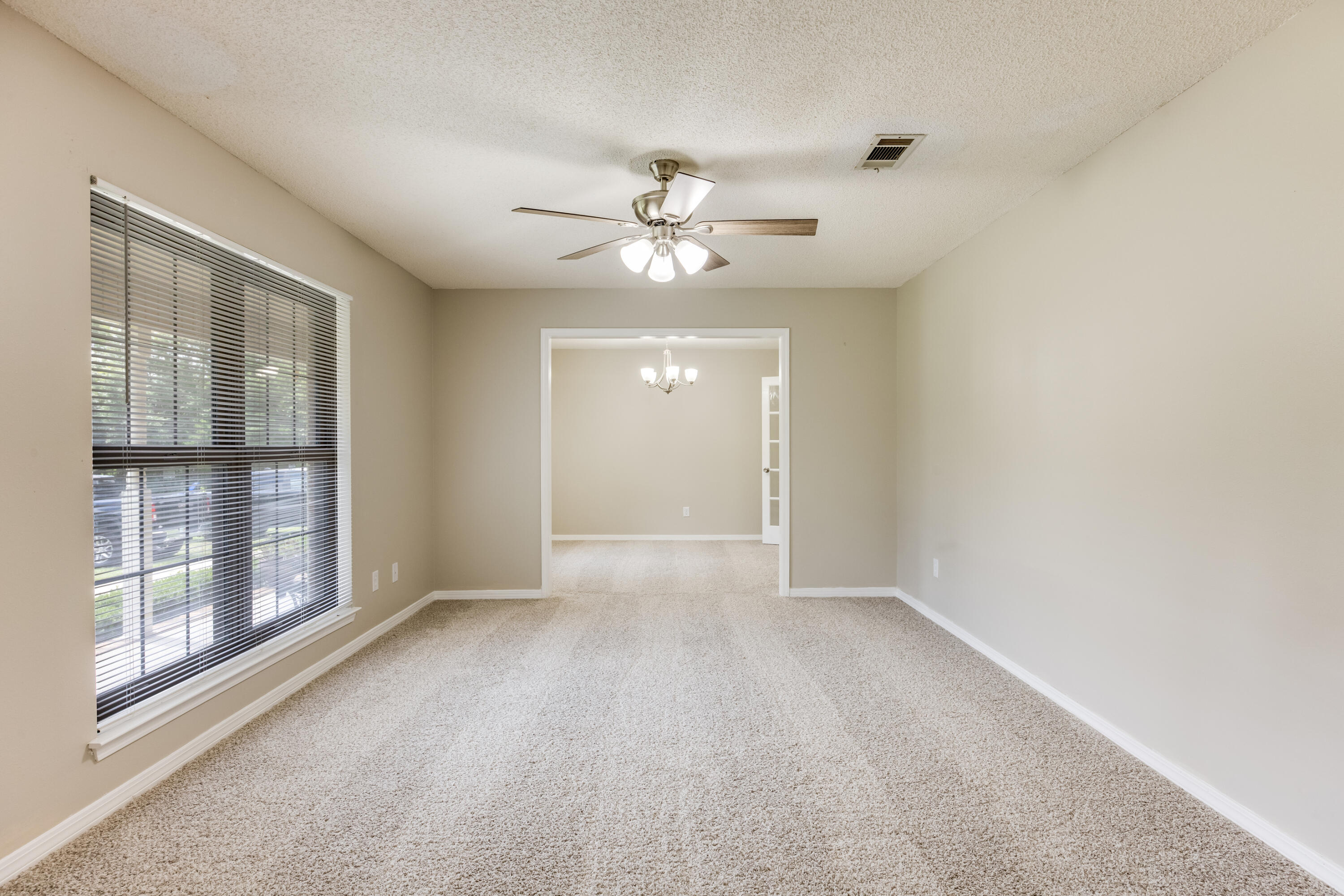 5892 Jack Stokes Road Baker, FL 32531 - Photo 5 of 49 a view of an empty room with a window