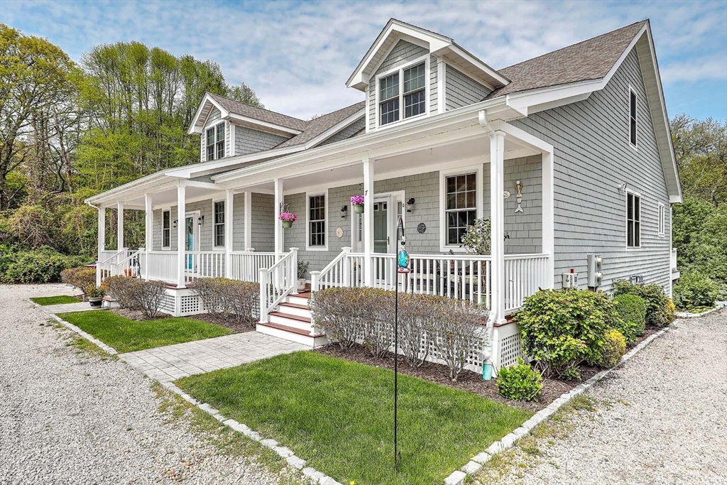 1346 Main Road, Unit 7 Westport, MA 02790 - Photo 1 of 20 front view of a house with a yard