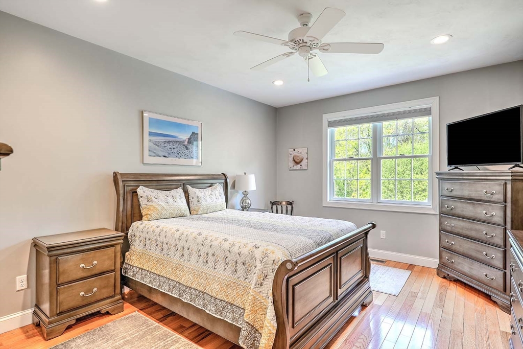 1346 Main Road, Unit 7 Westport, MA 02790 - Photo 12 of 20 a bedroom with a bed and a flat screen tv