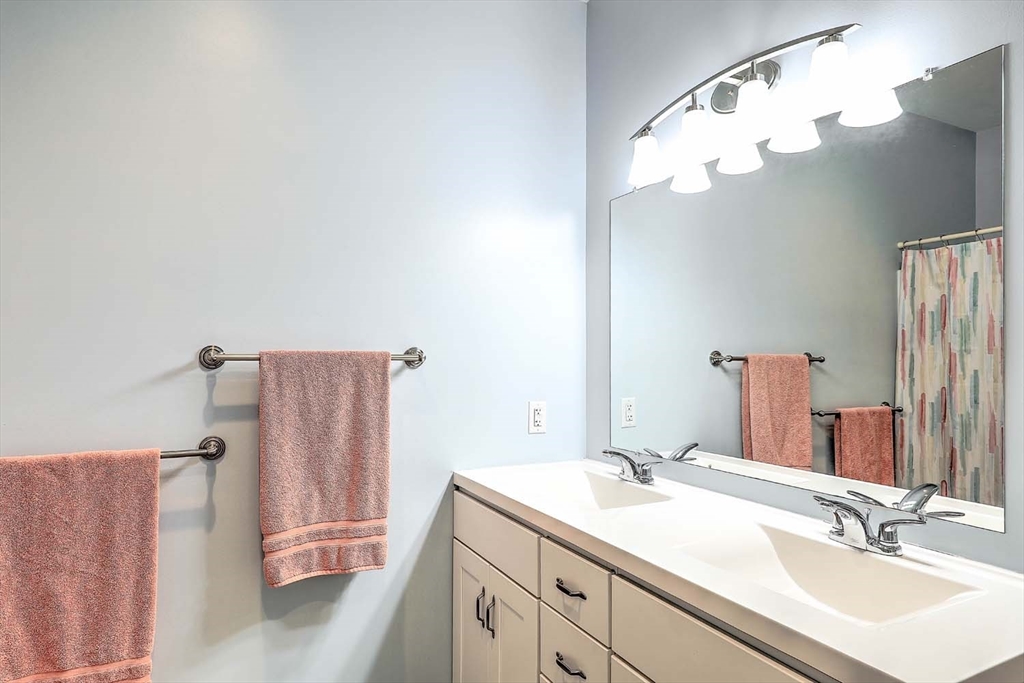1346 Main Road, Unit 7 Westport, MA 02790 - Photo 13 of 20 a bathroom with a sink and a mirror
