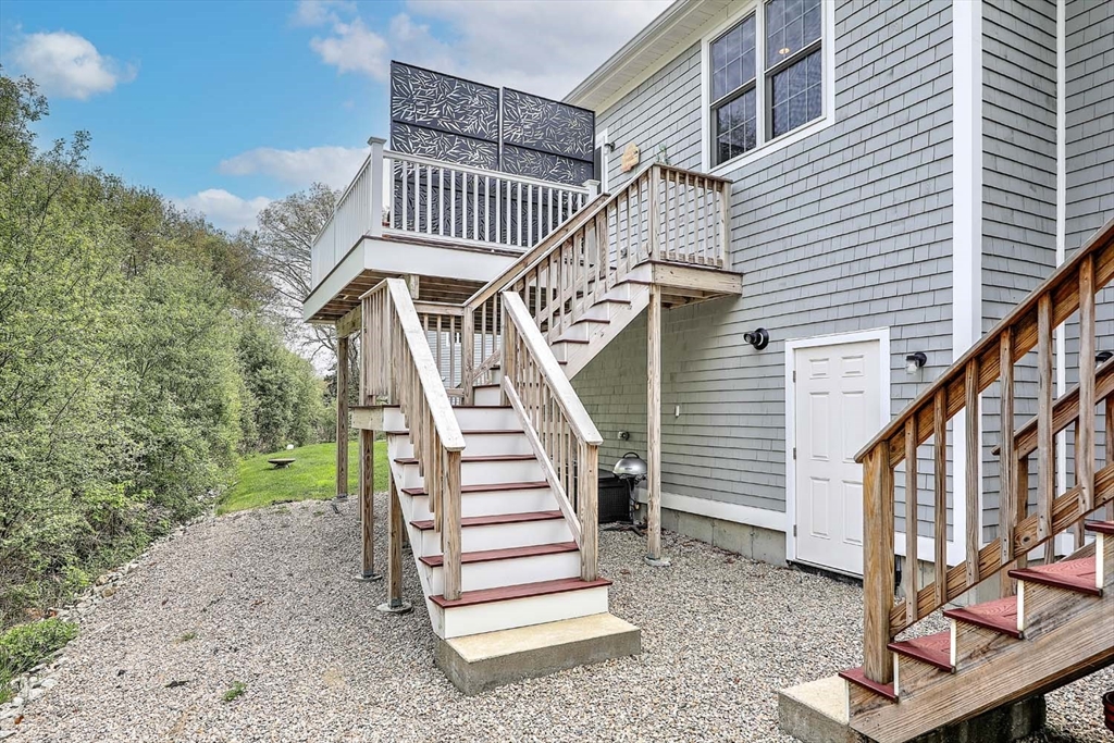 1346 Main Road, Unit 7 Westport, MA 02790 - Photo 18 of 20 a front view of a house with a yard