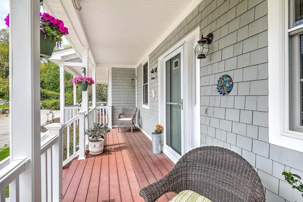 1346 Main Road, Unit 7 Westport, MA 02790 - Photo 2 of 20 a view of a balcony with wooden floor