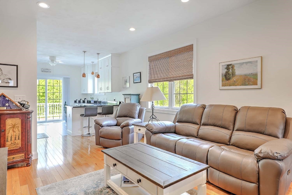 1346 Main Road, Unit 7 Westport, MA 02790 - Photo 5 of 20 a living room with furniture a flat screen tv and a window