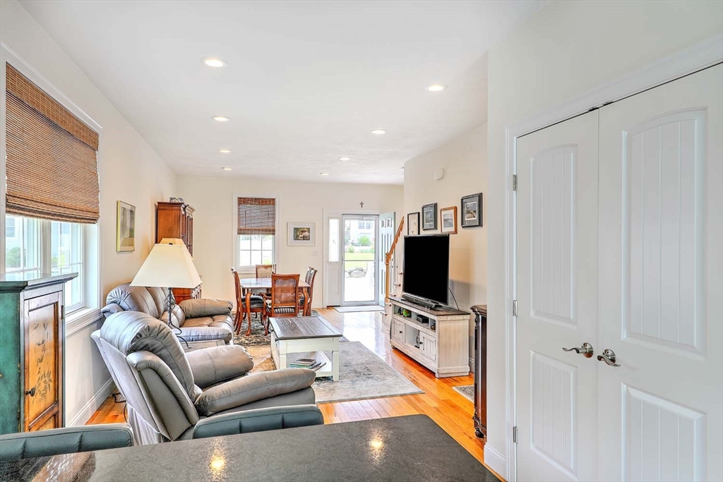 1346 Main Road, Unit 7 Westport, MA 02790 - Photo 6 of 20 a living room with furniture and a flat screen tv