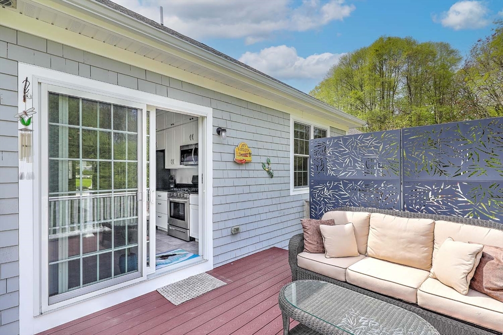 1346 Main Road, Unit 7 Westport, MA 02790 - Photo 10 of 20 a view of a couches in the back yard