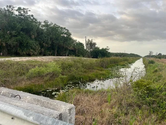 a view of a lake with a yard