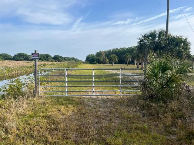 a view of a golf course with a lake view