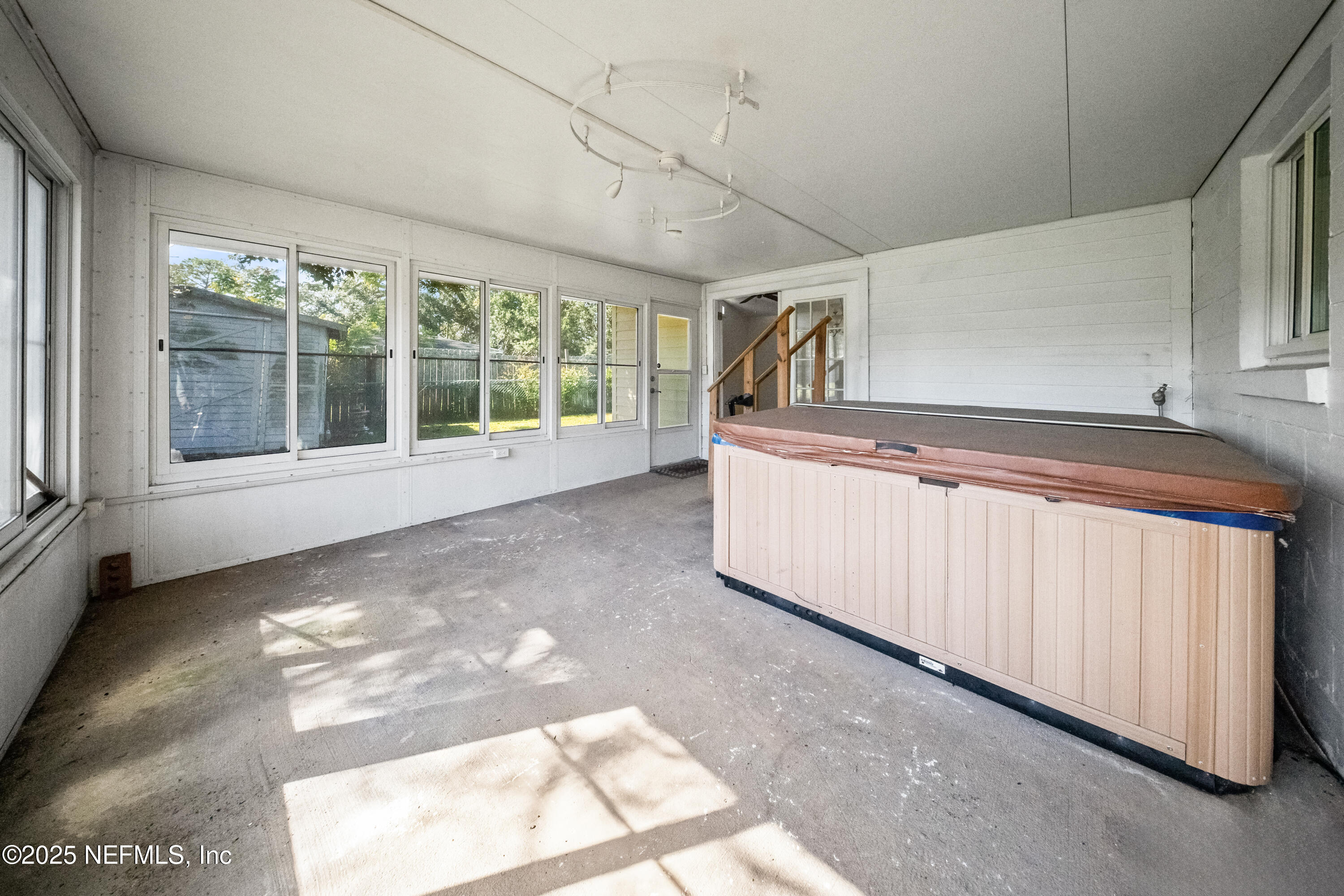 8342 Barracuda Road Jacksonville, FL 32244 - Photo 17 of 20 a view of an empty room with a window