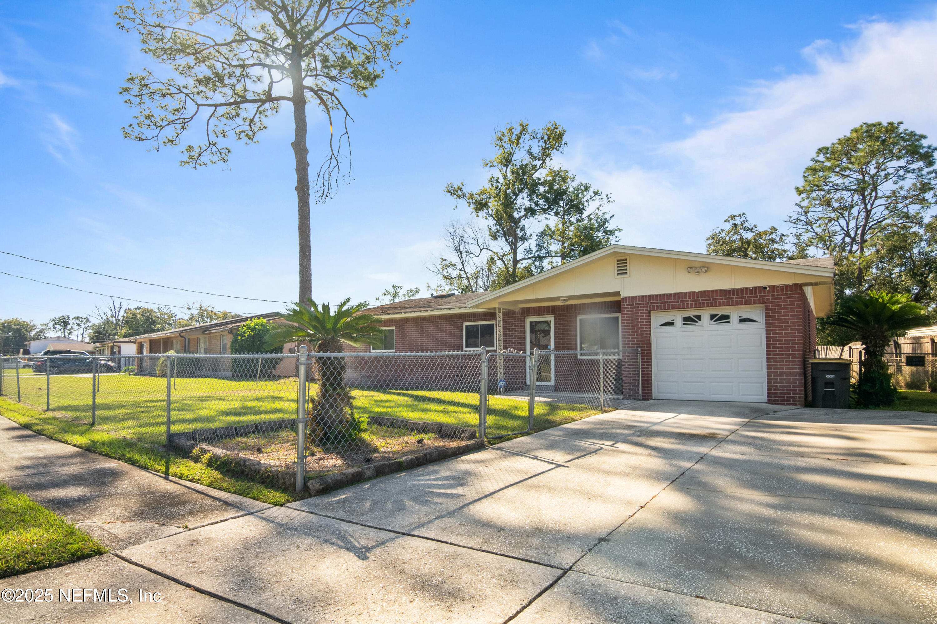 8342 Barracuda Road Jacksonville, FL 32244 - Photo 2 of 20 a view of a house with backyard and a garden
