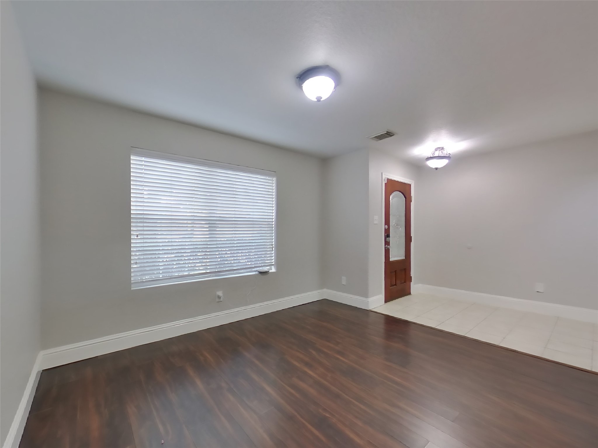 19626 Beachy Court Katy, TX 77449 - Photo 4 of 19 an empty room with wooden floor and windows