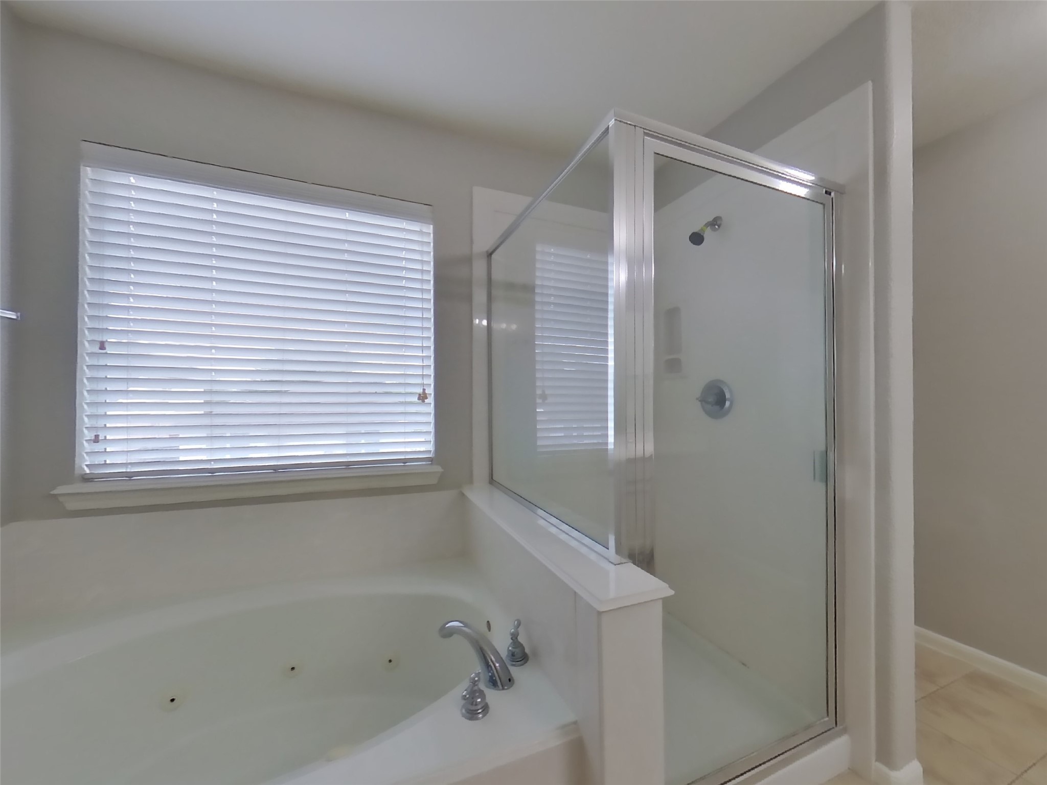 19626 Beachy Court Katy, TX 77449 - Photo 9 of 19 a bathroom with a bathtub and a shower