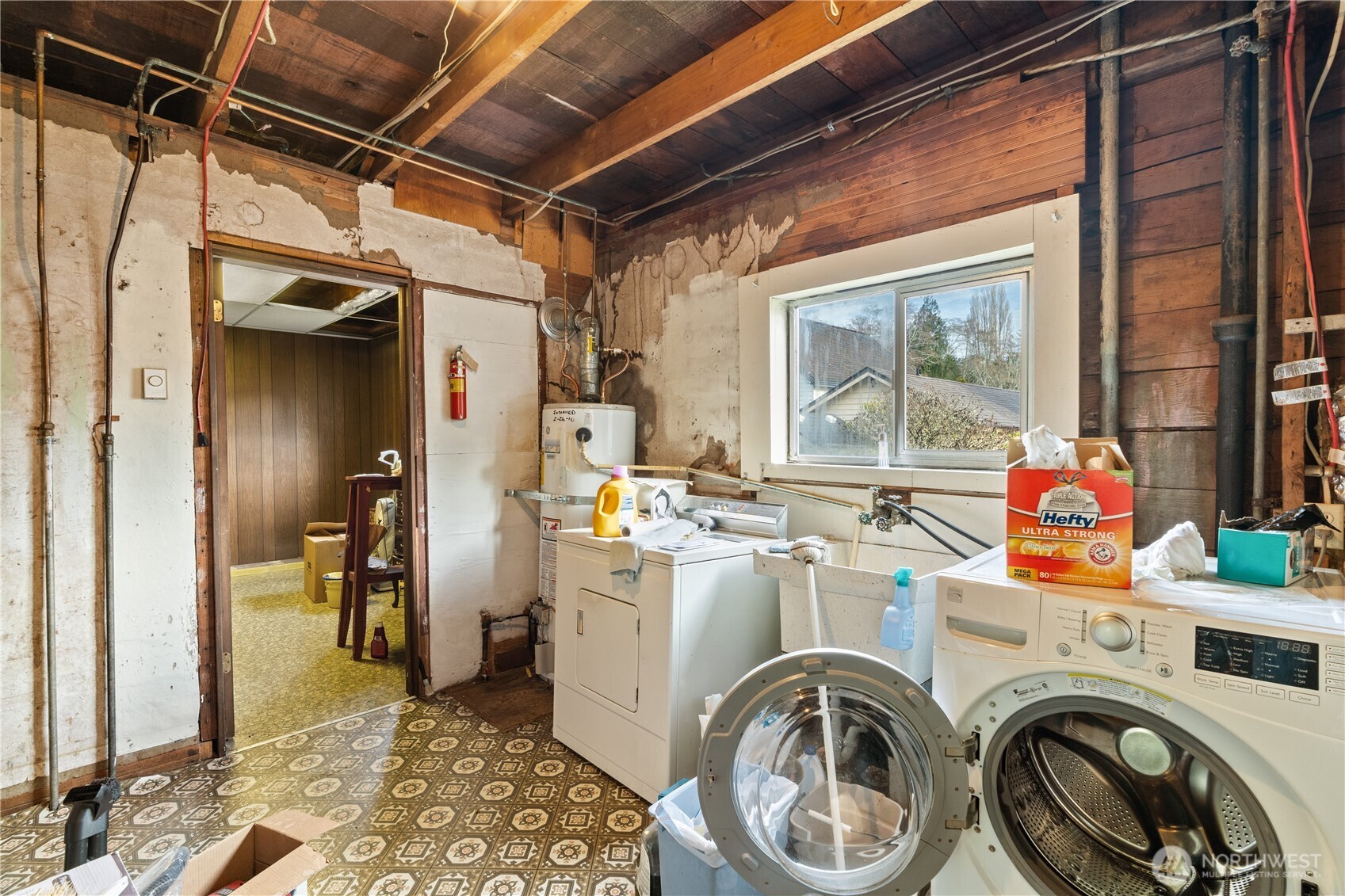 324 North F Street Aberdeen, WA 98520 - Photo 19 of 32 a view of storage and utility room with washer and dryer