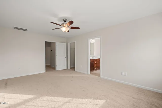 a view of a big room with carpet