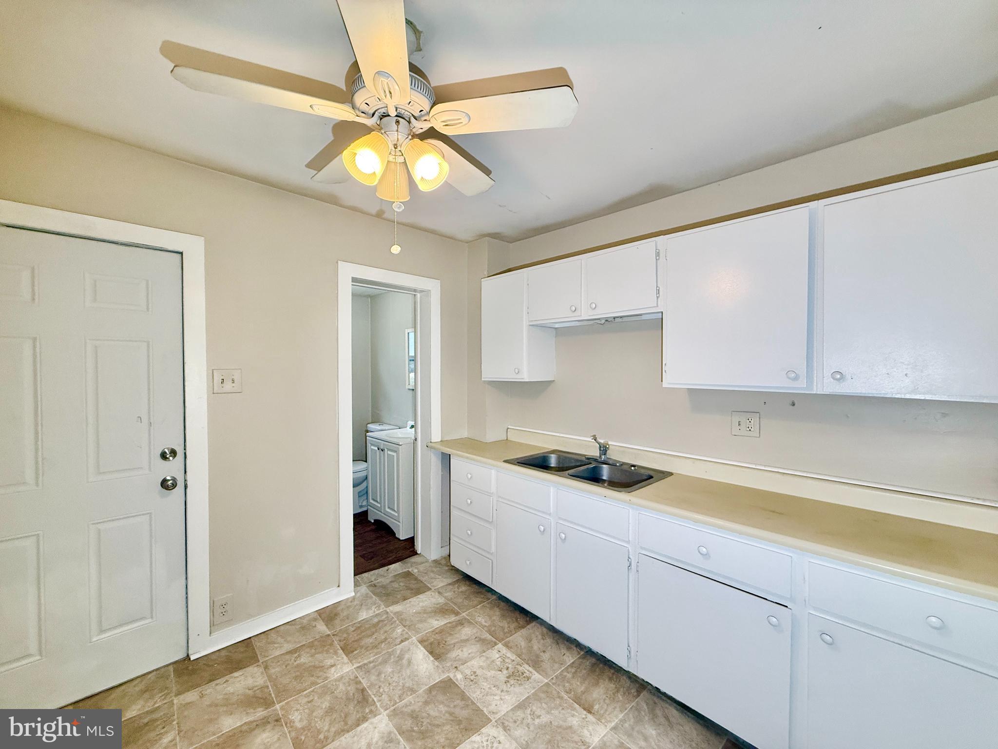 5 Craven Avenue Salem, NJ 08079 - Photo 4 of 13 a kitchen with a sink and cabinets