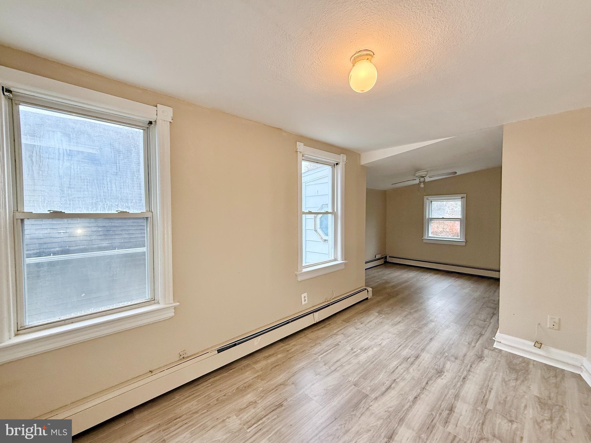 5 Craven Avenue Salem, NJ 08079 - Photo 7 of 13 a view of an empty room with wooden floor and a window