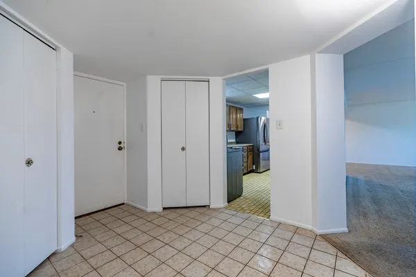 a view of an empty room with a window