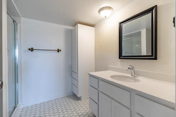 a bathroom with a sink and a mirror