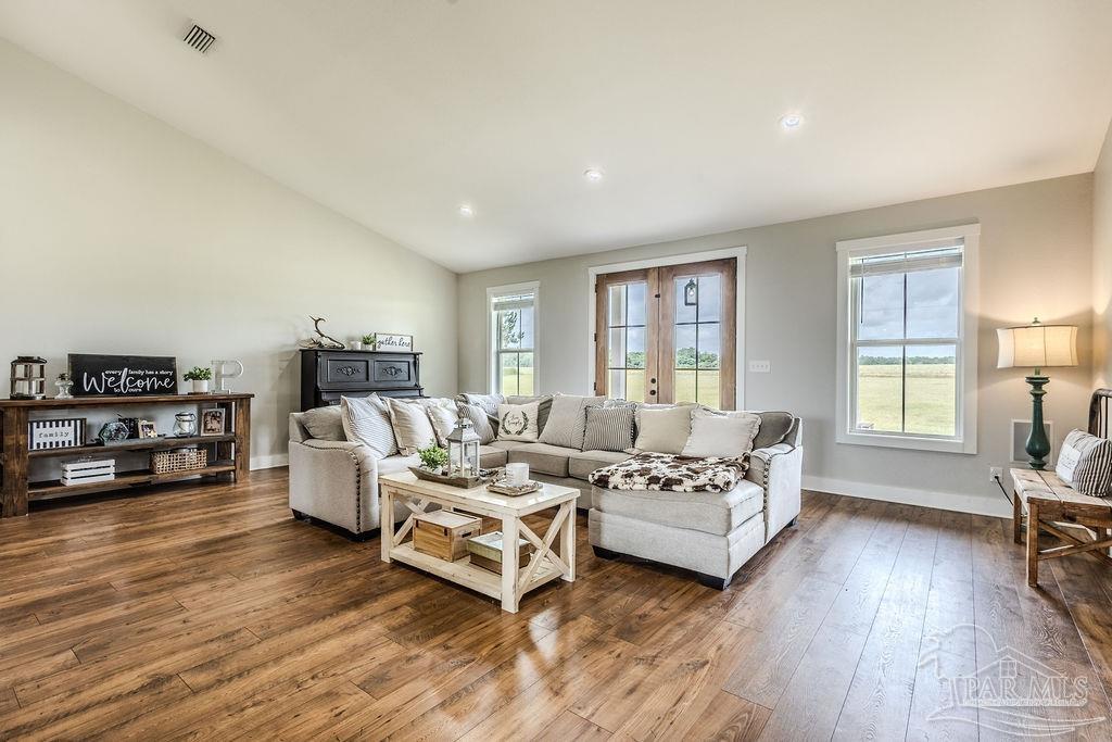 778 Griswold Road Jay, FL 32565 - Photo 12 of 57 a living room with furniture and a wooden floor