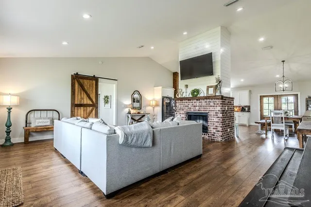a room with a sink a window and cabinets