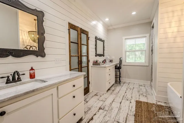 a room with a sink and a mirror