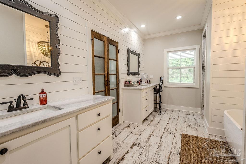 778 Griswold Road Jay, FL 32565 - Photo 17 of 57 a room with a sink a window and cabinets