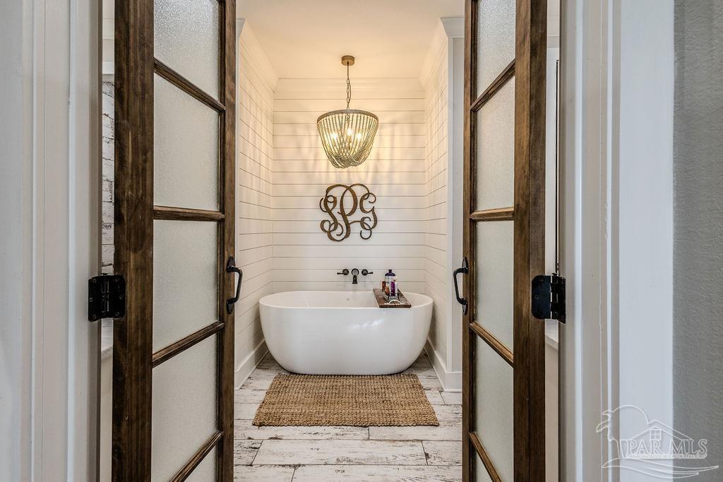 778 Griswold Road Jay, FL 32565 - Photo 20 of 57 a bathroom with a sink and mirror with bathtub