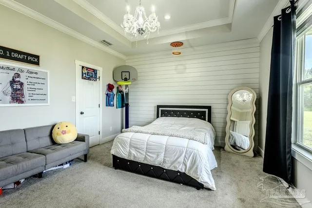 a view of a hallway with wooden floor and entryway