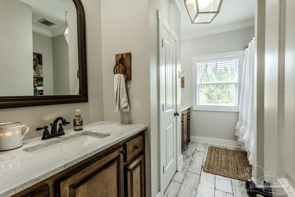 778 Griswold Road Jay, FL 32565 - Photo 24 of 57 a bathroom with a sink and a mirror