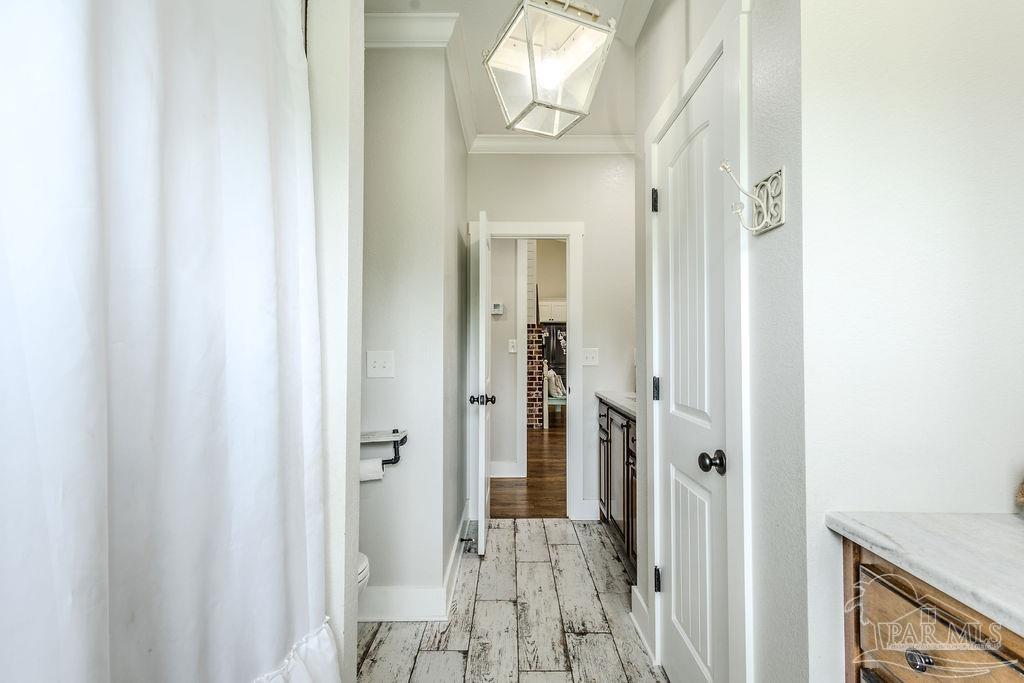 778 Griswold Road Jay, FL 32565 - Photo 28 of 57 a view of a hallway with wooden floor and entryway