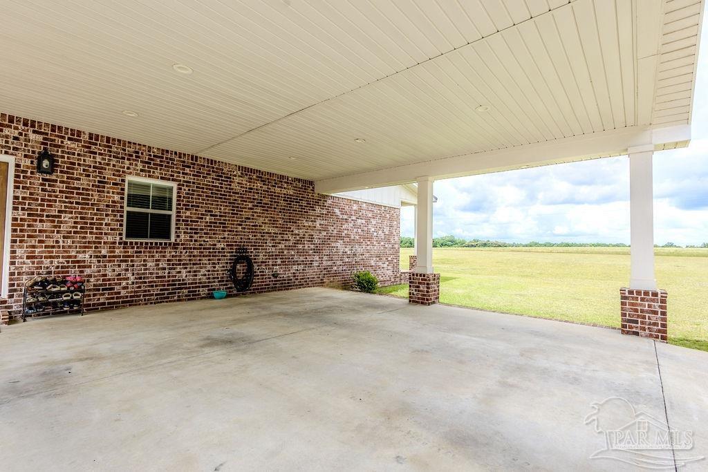 778 Griswold Road Jay, FL 32565 - Photo 32 of 57 a view of an empty room with a floor to ceiling window